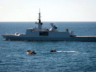 Somali pirates being apprehended by the French naval police. AFP.