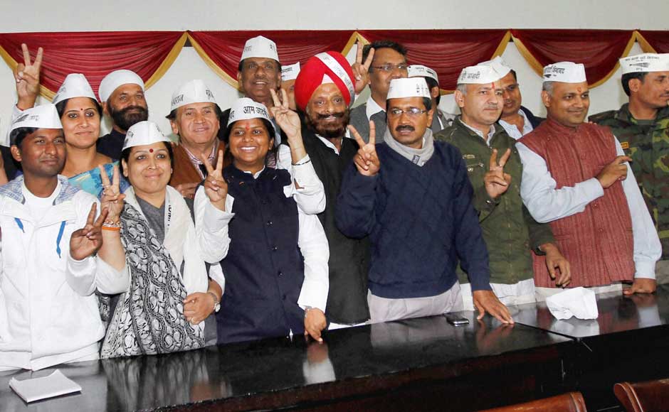 Aam Aadmi Party convener Arvind Kejriwal poses with the party's newly elected MLAs during a meeting in New Delhi on Monday.PTI Aam Aadmi Party convener Arvind Kejriwal poses with the party's newly elected MLAs during a meeting in New Delhi on Monday.PTI