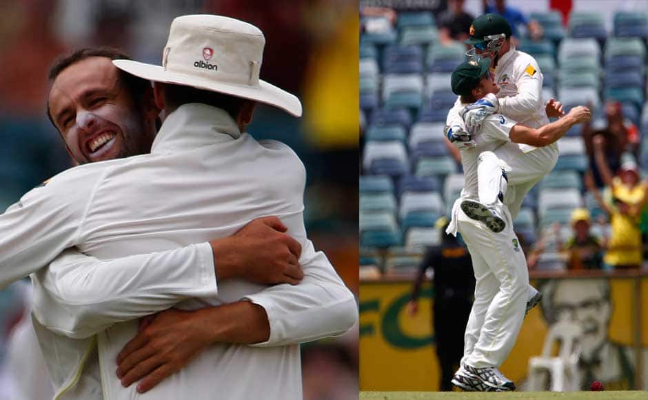 Australia's Nathan Lyon (L) celebrates with captain Michael Clarke (R) Australia's wicket-keeper Brad Haddin (R) celebrates with Shane Watson after he caught out to dismiss England's Ben Stokes during the fifth and final day of the third Ashes test cricket match at the WACA ground in Perth December 17 2013. REUTERS