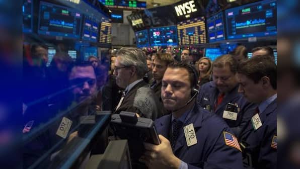 US stocks rise after Fed says it will taper bond buying