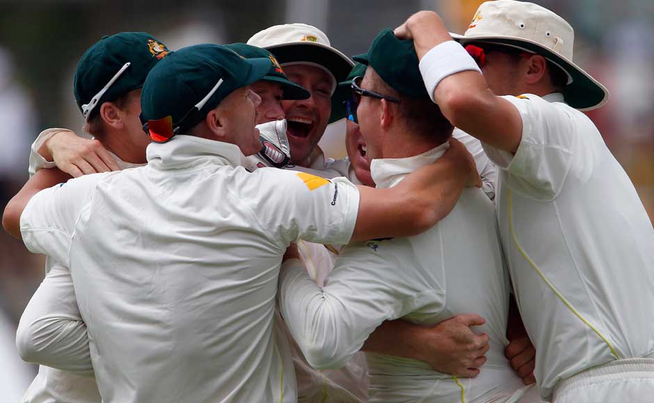 Australia's captain Michael Clarke (C) celebrates with teammates after winning the third Ashes test cricket match against England at the WACA ground in Perth December 17, 2013. Australia beat England by 150 runs in the third test at the WACA on Tuesday to take an unassailable 3-0 lead in the five-match series and reclaim the Ashes. REUTERS