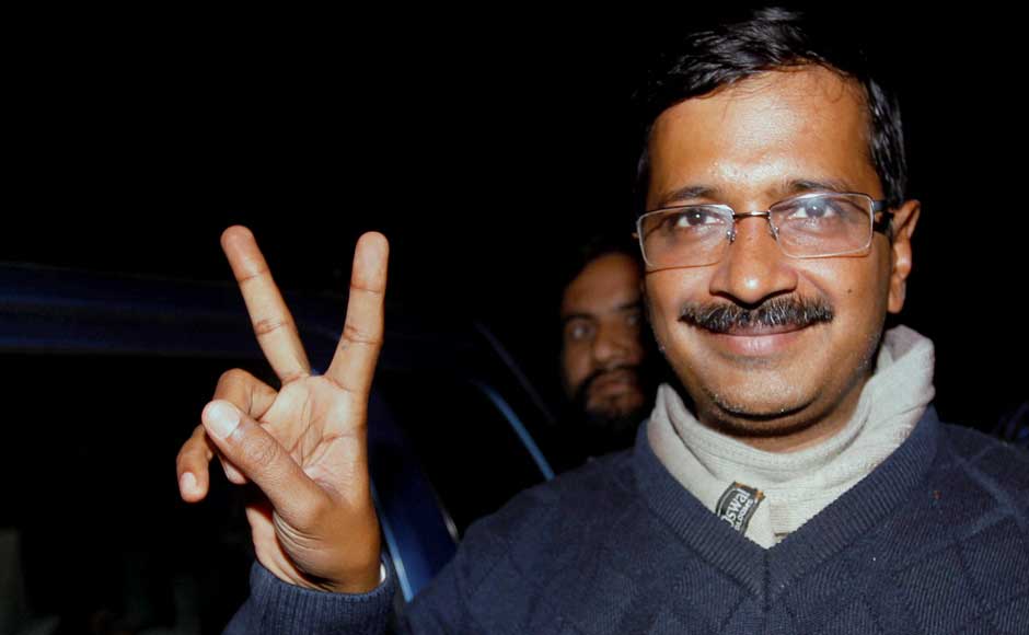 Aam Aadmi Party convener Arvind Kejriwal flashes victory sign as he arrives for a meeting with party newly elected representatives on Monday.PTI Aam Aadmi Party convener Arvind Kejriwal flashes victory sign as he arrives for a meeting with party newly elected representatives on Monday.PTI