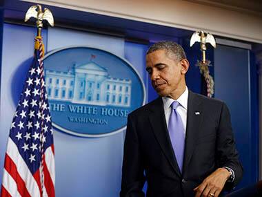 President Barack Obama leaves the podium after his end-of-the-year news conference in the Brady Press Room at the White House in Washington, Friday. AP
