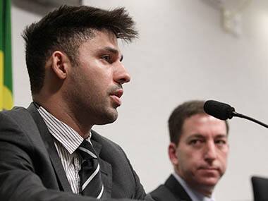 A file photo of David Miranda, the partner of American journalist Glenn Greenwald, right, speaks to a congressional committee investigating reports. AP