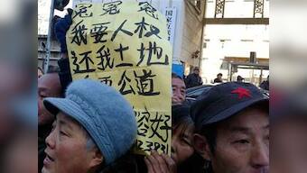 Residents protest demolition of homes by drinking pesticide in Beijing
