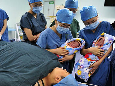 China plans to introduce 'baby bonus' to encourage couples to have second child China plans to introduce 'baby bonus' to encourage couples to have second child