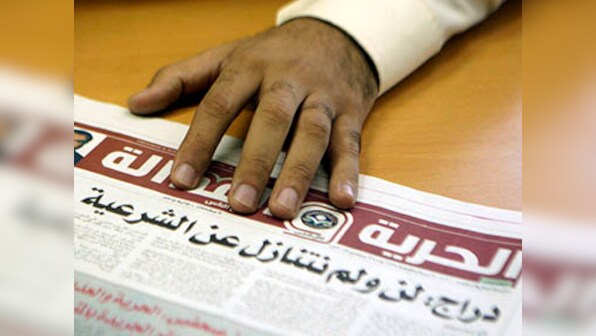 Four of Al Jazeera's journalists held in Egypt after hotel broadcast