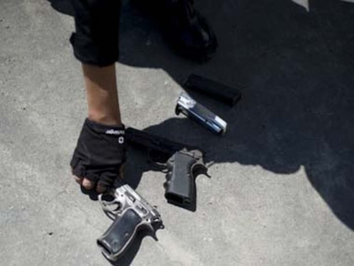 Cops seize huge cache of arms, nab two smugglers Cops seize huge cache of arms, nab two smugglers