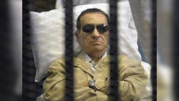 Egypt's ex-PM, Mubarak's sons acquitted by court of corruption charges