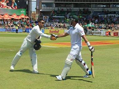 Dhoni greets Kallis as the SA great walks in to bat. AP