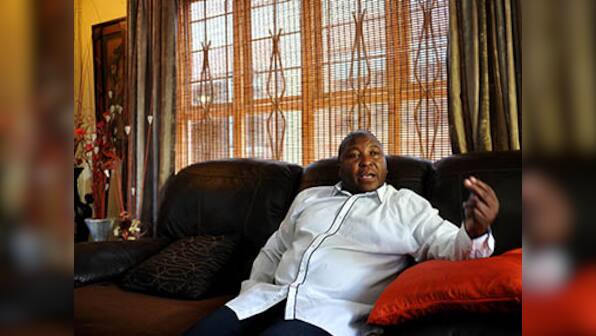 Bogus signer at Mandela memorial was part of group that burned men 