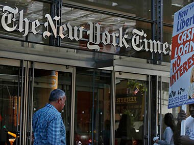 People walk past the New York Times Building in New York. Reuters