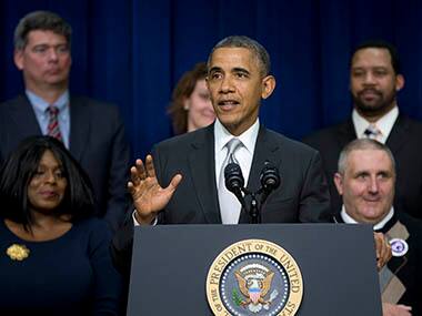 President Barack Obama gestures as he speaks about the new health care law, Tuesday, Dec. 3, 2013, in the South Court Auditorium in the Eisenhower Executive Office Building on the White House complex in Washington. The president said his signature health care law 