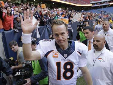 Peyton Manning waves to the fans after breaking the single-season record for touch down passes in the NFL. AP