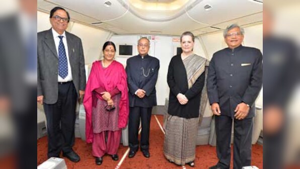  Birthday boy: President Pranab cuts cake aboard Air India One 