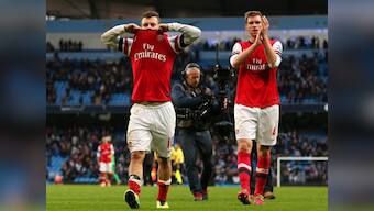 Wilshere charged for offensive hand gesture towards Man City fans