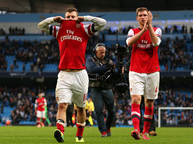 Wilshere charged for offensive hand gesture towards Man City fans Wilshere charged for offensive hand gesture towards Man City fans