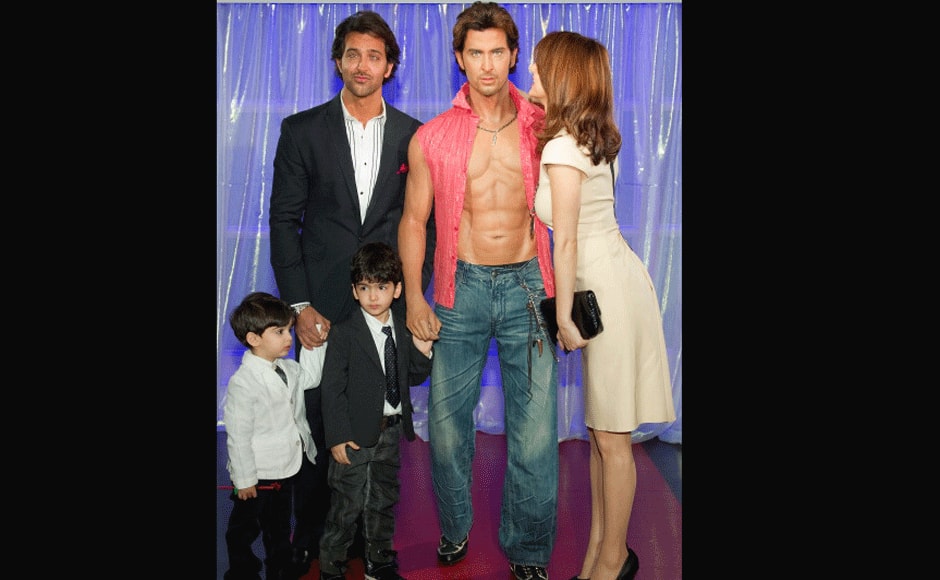 Roshan (2nd L) jokes with his wife Sussanne Roshan (R) and two sons Hridhaan (L) and Hrehaan (C) as a wax figure of himself is unveiled at the Madame Tussauds waxwork museum in central London, on January 20, 2011. Getty Images