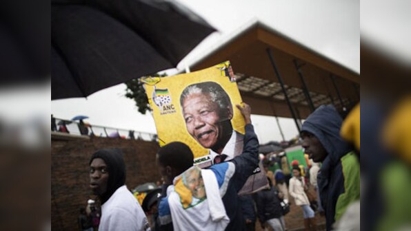 Mandela's 'long walk' nears end, body taken to ancestral village