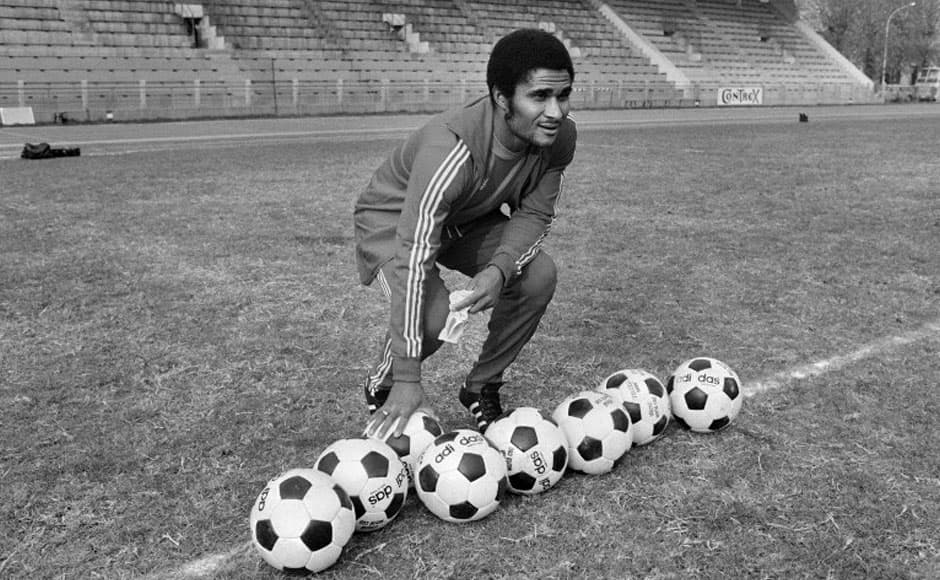 A file picture taken on October 30, 1973 in the Bois de Boulogne shows former Portuguese football legend Eusebio da Silva Ferreira, more commonly known as Eusebio, posing with soccer balls. Eusebio, who was the 1965 European Footballer of the Year and considered one of the best footballers of all time and best ever from Portugal, died at age 71 on January 5, 2014. AFP