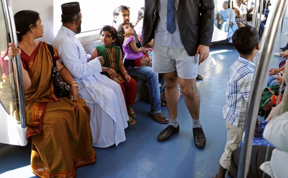 An Indian commuter, stripped to his underpants, participates in a No Pants Subway Ride on the metro in Bangalore on January 12, 2014. The No Pants Subway Ride is an annual event staged across major cities of the World every January. The mission started as a small prank with seven guys and has grown into an international celebration of silliness, with dozens of cities around the world participating each year. The idea behind No Pants is simple - random passengers board a subway car at separate stops in the middle of winter without pants. AFP