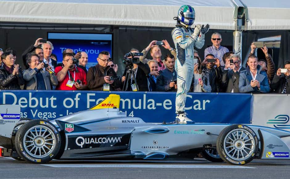 Official driver Lucas di Grassi stands atop Formula Eís new fully-electric race car, the Spark-Renault SRT_01E, entertaining crowds with a high-speed display around the Mandalay Bay Resort & Casino during the 2014 International CES on January 6, 2014 in Las Vegas, Nevada. AFP