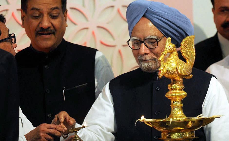 Prime Minister Manmohan Singh with Maharashtra CM Prithviraj Chavan lighting the lamp during the inauguration of Chatrapati Shivaji International Airport's Terminal 2 in Mumbai on Friday. PTI 