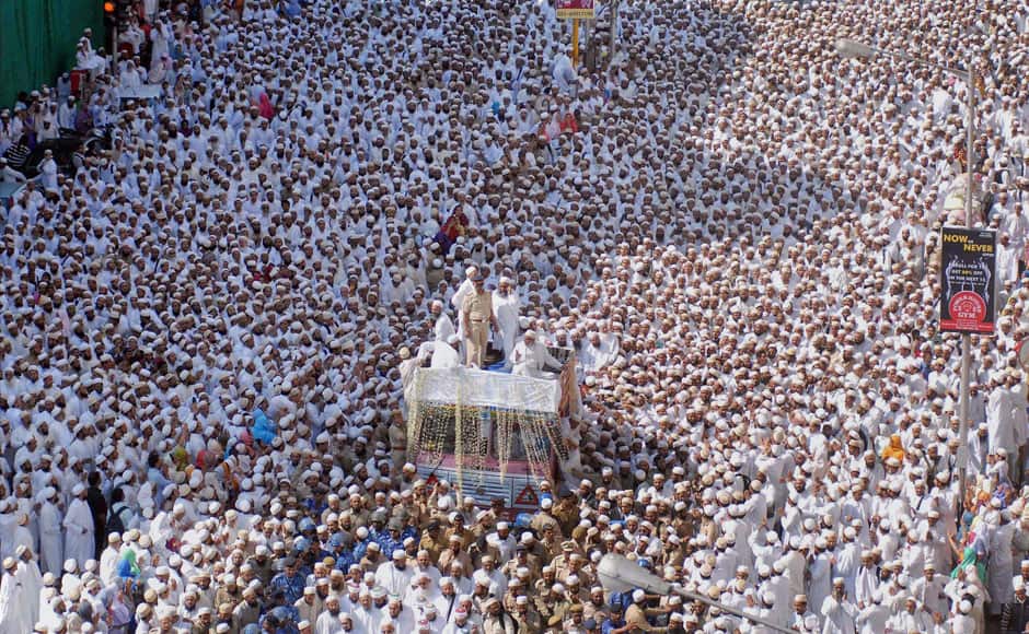 Bohra community members particiapte in the funeral procession of their spiritual leader Syedna Mohammed Burhanuddin in south Mumbai on Saturday. PTI 