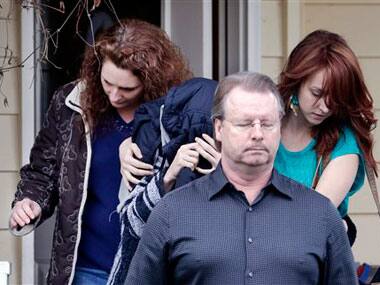 Amanda Knox with her family members at the court house: AP