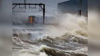 High winds, waves lash Britain's coast flooding seaside towns