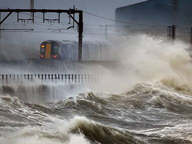High winds, waves lash Britain's coast flooding seaside towns