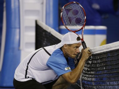 Australia's Lleyton Hewitt ducks as a ball passes above him during an exhibition match on Kids Tennis Day ahead of the Australian Open tennis championship in Melbourne. AP
