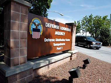 Vehicle passes through the front entrance of the the Defense Logistics Agency's huge storage facility outside Harrisburg, Pennsylvania. Reuters