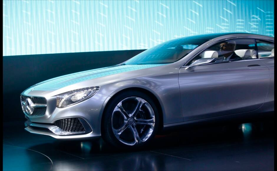 Chairman of Daimler AG and Head of Mercedes-Benz cars Dieter Zetsche sits in S Class Concept Coupe during the press preview day of the North American International Auto Show in Detroit, Michigan January 13, 2014. REUTERS