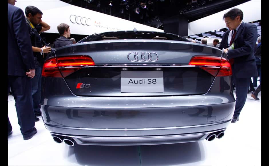 Members of the media look over an Audi S8 during the press preview day of the North American International Auto Show in Detroit, Michigan January 13, 2014. REUTERS