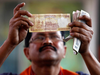 Rupee to stabilise at 62 by end of this year after 2013 slide: Poll Rupee to stabilise at 62 by end of this year after 2013 slide: Poll