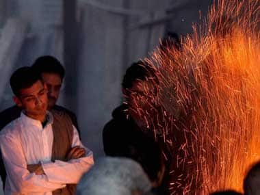 Shiv Menon during cremation of his mother Sunanda Pushkar at Lodhi Road crematorium in New Delhi on Saturday. PTI