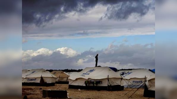 Greece moves 635 asylum seekers from overcrowded island of Lesbos to mainland via passenger ship