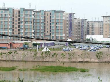 File photo - Flood water from the Yamuna River rising by the Commonwealth Games village in New Delhi. AFP