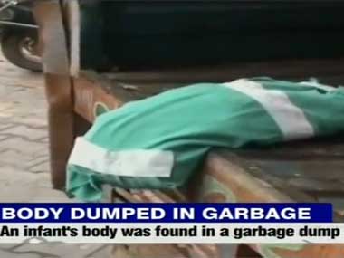 Delhi hospital dumps infant's body with garbage, govt promises action Delhi hospital dumps infant's body with garbage, govt promises action