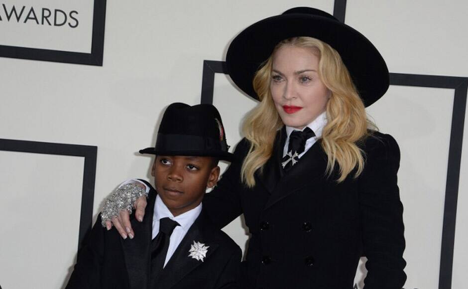 Madge was joined on the red carpet by her eight-year-old son David. She suited up in wide-legged trousers and jacket from Ralph Lauren, which she accessorised with an Amish-inspired hat and a cane. AFP image