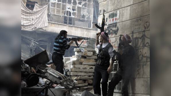 Suicide bomber with al-Qaeda links kills 13 soldiers in Syria