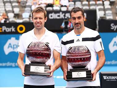 Daniel Nestor of Canada and Nenad Zimonjic of Serbia pose with trophies after winning the Mens Doubles Final against Rohan Bopanna of India and Aisam-Ul-Haq Qureshi of Pakistan. Getty Images