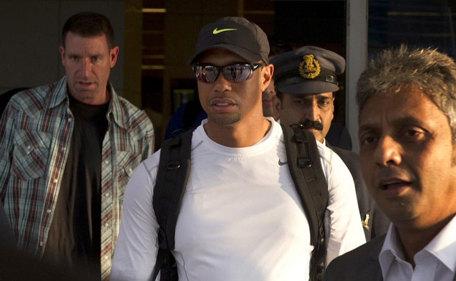 US golfer Tiger Woods (C) arrives at the International airport in New Delhi. Tiger Woods is making his first visit to India and will compete, in an 18-hole corporate outing at the Delhi Golf Club. AFP US golfer Tiger Woods (C) arrives at the International airport in New Delhi. Tiger Woods is making his first visit to India and will compete, in an 18-hole corporate outing at the Delhi Golf Club. AFP