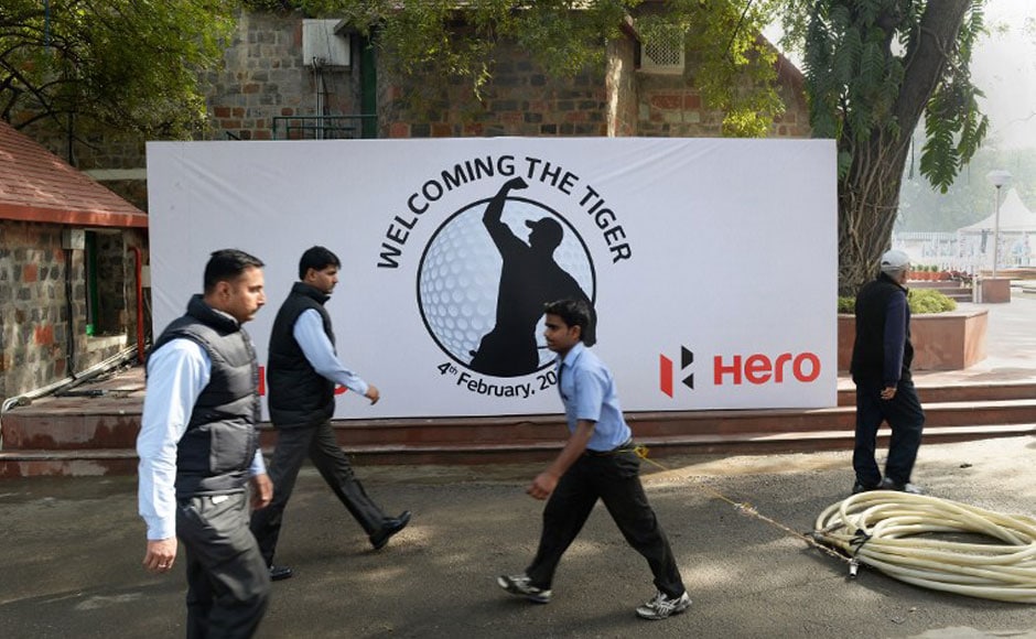 Workers arrange signs featuring images of US golfer Tiger Woods at The Delhi Golf Club in New Delhi. AFP Workers arrange signs featuring images of US golfer Tiger Woods at The Delhi Golf Club in New Delhi. AFP