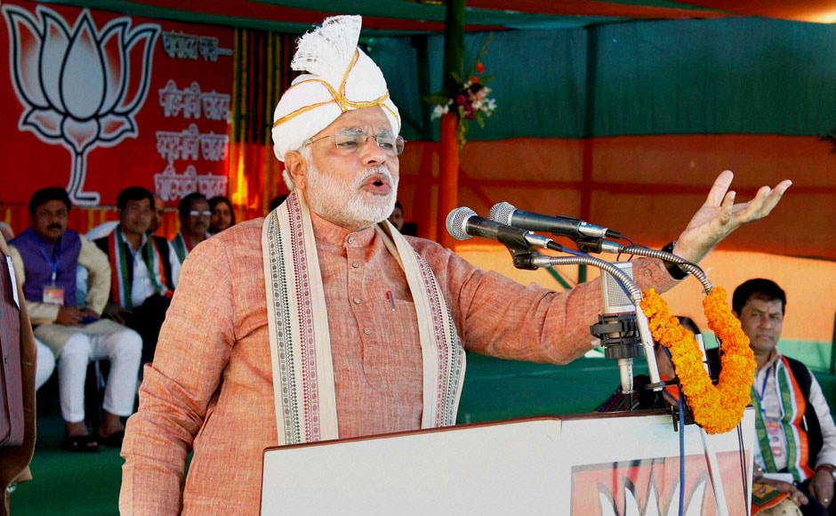 BJP Prime Ministerial candidate Narendra Modi addressing “Barak Bikash Samabesh” rally at Ramnagar in Silchar, Assam on Saturday. He's wearing a traditional Koyet turban in this picture. PTI BJP Prime Ministerial candidate Narendra Modi addressing “Barak Bikash Samabesh” rally at Ramnagar in Silchar, Assam on Saturday. He's wearing a traditional Koyet turban in this picture. PTI