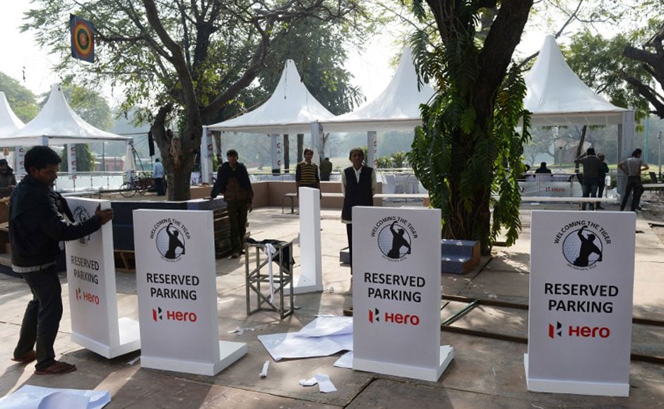 Private security guards stand in front of a billboard featuring images of US golfer Tiger Woods at The Delhi Golf Club in New Delhi. AFP Private security guards stand in front of a billboard featuring images of US golfer Tiger Woods at The Delhi Golf Club in New Delhi. AFP