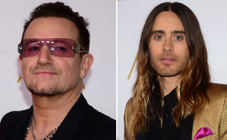 (L) Paul David Hewson, better known as Bono from the rock group U2. (R) Jared Leto poses on arrival for the 86th Oscar's Nominee's Luncheon at the Beverly Hilton Hotel in Beverly Hills, California, on February 10, 2014. AFP 