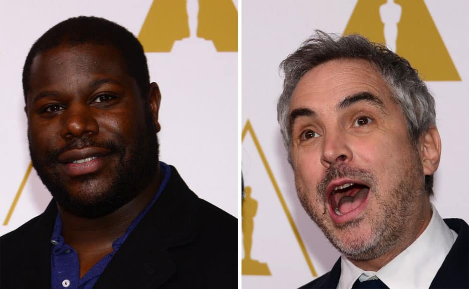 Steve McQueen, Alfonso Cuaron poses on arrival for the 86th Oscar's Nominee's Luncheon at the Beverly Hilton Hotel in Beverly Hills, California, on February 10, 2014. AFP