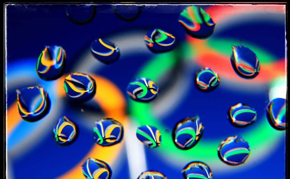 The Olympic Rings are seen in water droplets (This image was processed using digital filters). Getty Images